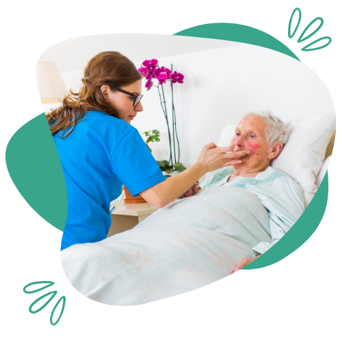 Caregiver providing bedside support and monitoring to a senior during 24-hour care services in Fishers, IN
