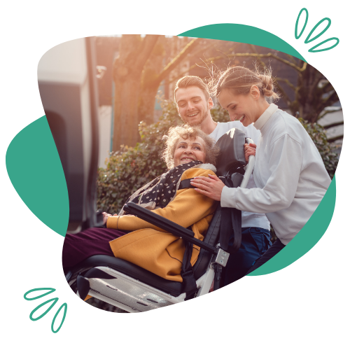 Caregiver assisting a senior in a wheelchair during a non-emergency transportation service in Fishers, IN